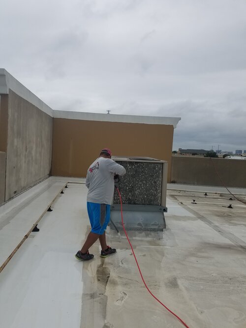 Brandon Cleaning The Roof Before We Start The Coating Process